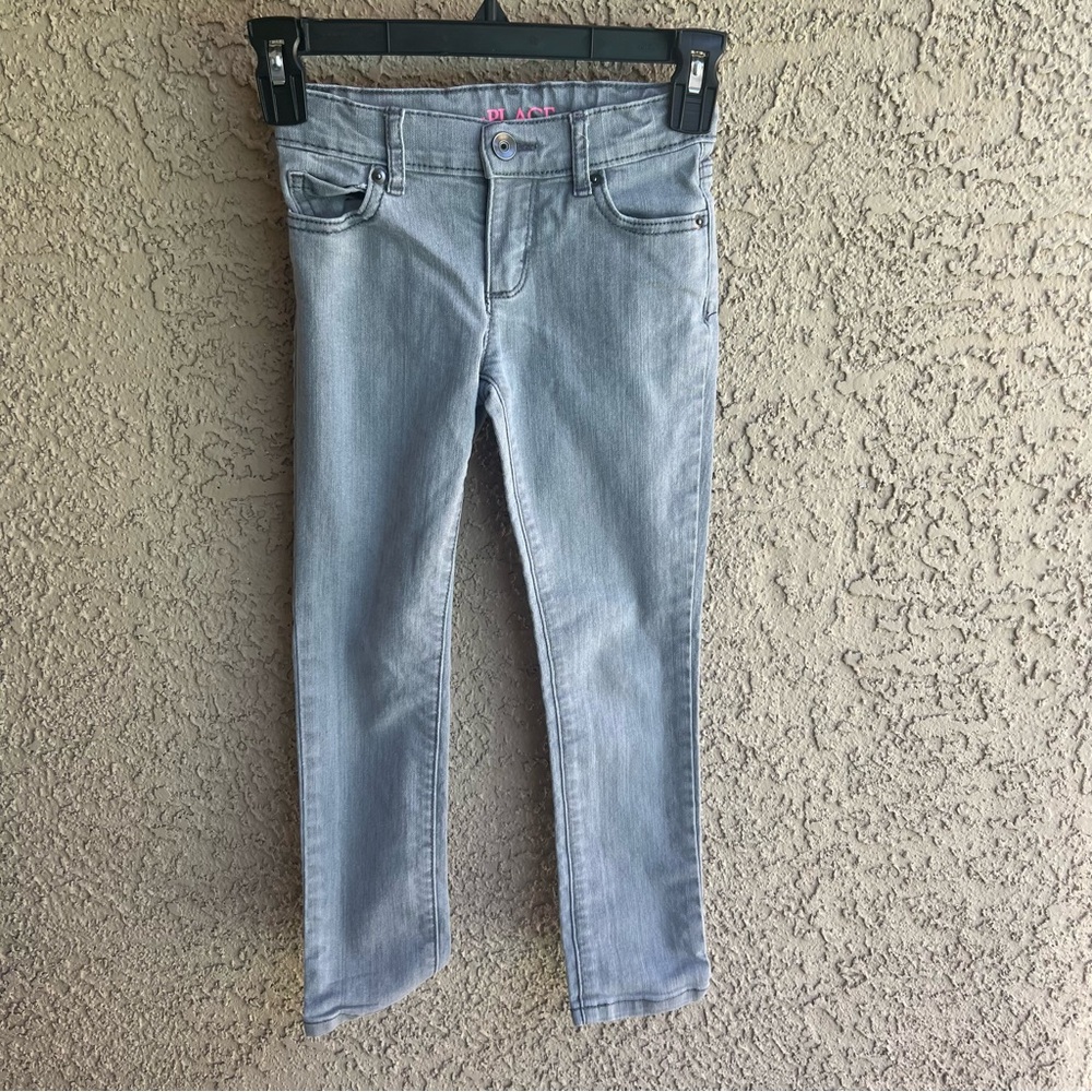 Children place skinny jeans